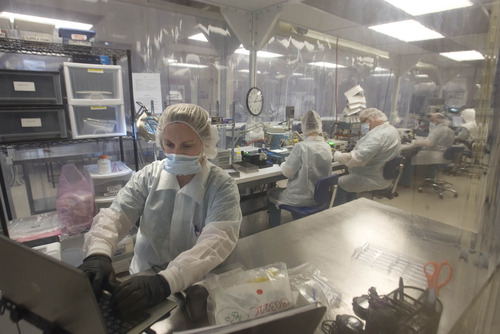 Paul Fraughton  |  The Salt Lake Tribune
Technicians at Biofire work in a clean room performing one of the manufacturing processes in the creation of the company's FilmArray Panels used in the medical field to test for viruses and bacteria causing upper respiratory infections.
 Friday, March 22, 2013