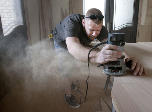 Steve Griffin | The Salt Lake Tribune


Contractor, Benjamin Thompson, works on the finish woodwork, on a home project in Bluffdale, Utah Thursday March 7, 2013. The state has been putting more contractors on probation and revoking licenses because of financial issues. Thompson has had some personal credit problems, but says the business side of his life is clean. Now he's on probation as a "qualifier."
