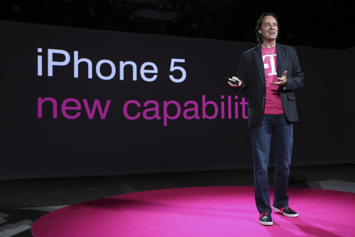 T-Mobile CEO John Legere speaks during a news conference Tuesday, March 26, 2013 in New York. T-Mobile will start offering the iPhone 5 on April 12, filling what Legere said was "a huge void" in its phone lineup. The company is currently the only major U.S. carrier not to offer Apple's popular smartphone. (AP Photo/Mary Altaffer)