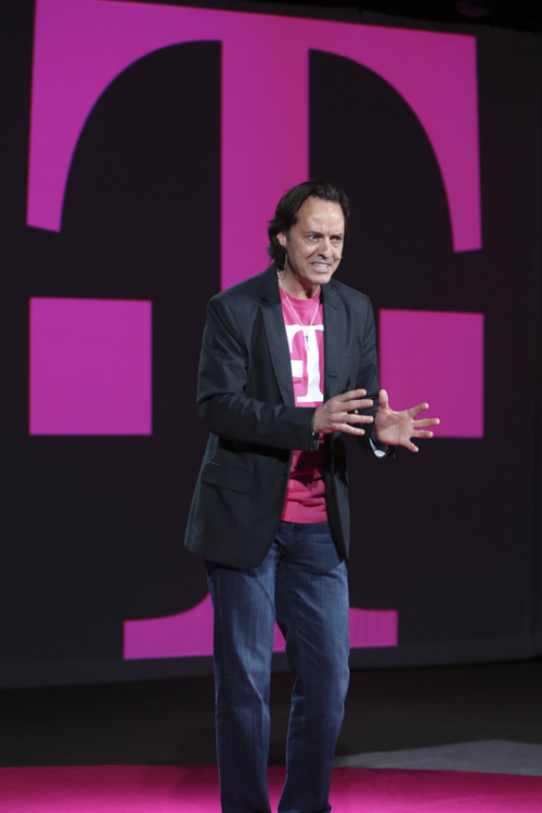 T-Mobile  CEO John Legere gestures as he speaks during a news conference,  Tuesday, March 26, 2013 in New York. T-Mobile will start offering the iPhone 5 on April 12. The company is currently the only major U.S. carrier not to offer Apple's popular smartphone.   (AP Photo/Mary Altaffer)