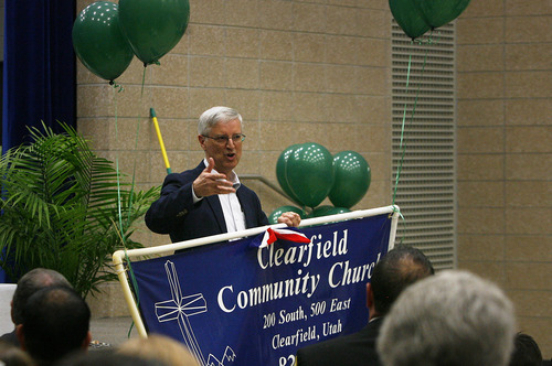 Scott Sommerdorf   |  The Salt Lake Tribune
Pastor John Parsley talks Sunday about the Clearfield Community Church sign that was salvaged from the fire that destroyed the church Tuesday. He spoke at Palm Sunday services at nearby Wasatch Elementary School, Sunday, March 24, 2013.