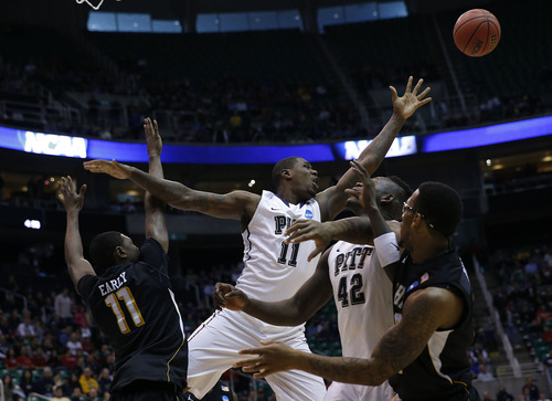 Chris Detrick  |  The Salt Lake Tribune

Pittsburgh Panthers forward Dante Taylor (11) loses control of the ball under pressure from Wichita's defense as the Panthers face the Shockers in the NCAA tournament at EnergySolutions Arena on Thursday, March 21, 2013.