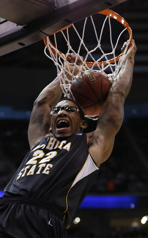 Trent Nelson  |  The Salt Lake Tribune

Wichita State Shockers forward Carl Hall (22) dunks as the Bulldogs face the Shockers in the NCAA tournament at EnergySolutions Arena on Saturday, March 23, 2013.
