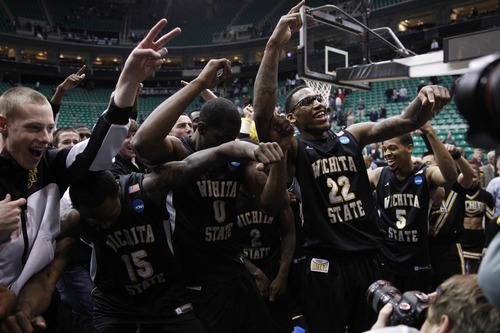 Trent Nelson  |  The Salt Lake Tribune

Wichita State Shockers forward Carl Hall (22) celebrates with his teammates after beating Gonzaga in the NCAA tournament at EnergySolutions Arena on Saturday, March 23, 2013.