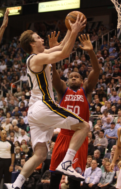 Rick Egan  | The Salt Lake Tribune 

Utah Jazz shooting guard Gordon Hayward (20) goes in for a lay up, as Philadelphia 76ers center Lavoy Allen (50) defends,  in NBA action, Jazz vs. the Sixers, at EnergySolutions Arena, Monday, March 25, 2013.