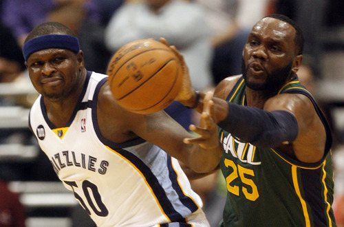 Rick Egan  | The Salt Lake Tribune 

Utah Jazz center Al Jefferson knocks the ball away from Memphis Grizzlies power forward Zach Randolph during a game at EnergySolutions Arena in Salt Lake City on Saturday, March 16, 2013.