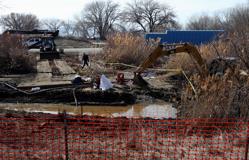 Rick Egan  | The Salt Lake Tribune 

Crews work on the oil spill near Willard Bay, Monday, March 25, 2013.