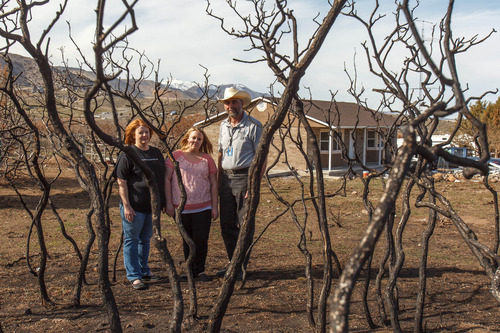 Trent Nelson  |  The Salt Lake Tribune
Michelle, Ashley and Tim Givan have moved back into their home, after a fire burned it down last year. Thursday March 14, 2013 in Herriman.
