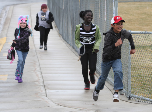 Rick Egan  | The Salt Lake Tribune 
Sixth-graders Celeste Camomile, left, Serena Candelaria, Sapira Owda and John Mendoza make their daily run around the school before lunch Thursday, March 21, 2013. About halfway into the Intermountain Medical Center Heart Institute's 2013 My Heart Challenge contest, 14 Salt Lake Valley school principals have already lost a combined 173 pounds in their quest for better health, and are now motivating their young students to join them along the way.