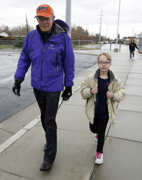 Rick Egan  |  The Salt Lake Tribune 
Fourth-grader Ennalynn Kofford walks with Newman Elementary School Principal John Erlacher before lunch on Thursday, March 21, 2013. About halfway into the Intermountain Medical Center Heart Institute's 2013 My Heart Challenge contest, 14 Salt Lake Valley school principals have already lost a combined 173 pounds in their quest for better health, and are now motivating their young students to join them along the way.