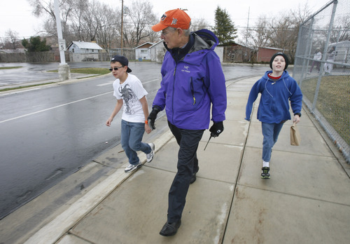 Rick Egan  |  The Salt Lake Tribune 
Haris Camacho, left, and Brayden Wonderlie walk with Newman Elementary School Principal John Erlacher before lunch on  Thursday, March 21, 2013. About halfway into the Intermountain Medical Center Heart Institute's 2013 My Heart Challenge contest, 14 Salt Lake Valley school principals have already lost a combined 173 pounds in their quest for better health, and are now motivating their young students to join them along the way.
