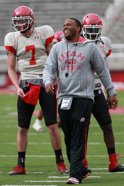 Leah Hogsten  |  The Salt Lake Tribune
University of Utah football team's Brian Johnson shares a laugh with  quarterbacks Travis Wilson and  Brandon Cox  during the Utes practice, Tuesday, March 26, 2013. Johnson has been demoted from offensive coordinator, but still coaches the quarterbacks as the "co-coordinator" with the newly hired Dennis Erickson.