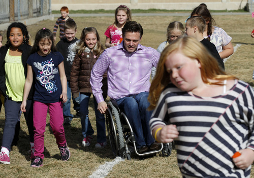 Al Hartmann  |  The Salt Lake Tribune
Crestview Elementary School students join Chris Waddell, the most decorated Paralympic skier in a 1 mile run around the school field Tuesday March 19 as part of the Jolly Jogger Program, which is aimed at getting consistent physical education in all schools because of its benefits for brain activity. Local Athletes for Hope joined them in the assembly and run.