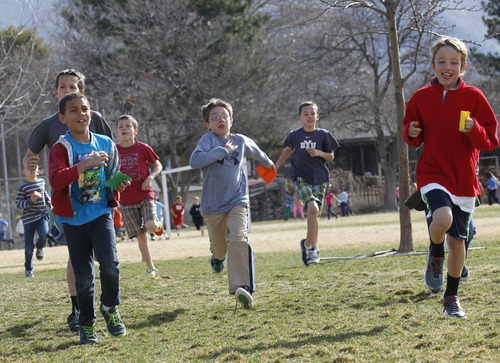 Al Hartmann  |  The Salt Lake Tribune
Crestview Elementary School students run 1 mile around the school field  Tuesday March 19 as part of  the Jolly Jogger Program, which is aimed at getting consistent physical education in all schools because of its benefits for brain activity.  Local Athletes for Hope joined them in the assembly and run.