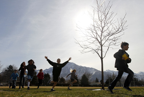 Al Hartmann  |  The Salt Lake Tribune
Crestview Elementary School students run 1 mile around the school field Tuesday March 19 as part of  the Jolly Jogger Program, which is aimed at getting consistent physical education in all schools because of its benefits for brain activity. Local Athletes for Hope joined them in the assembly and run.