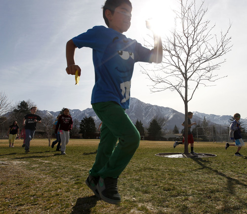 Al Hartmann  |  The Salt Lake Tribune
Crestview Elementary School students run 1 mile around the school field  Tuesday March 19 as part of  the Jolly Jogger Program, which is aimed at getting consistent physical education in all schools because of its benefits for brain activity.  Local Athletes for Hope joined them in the assembly and run.