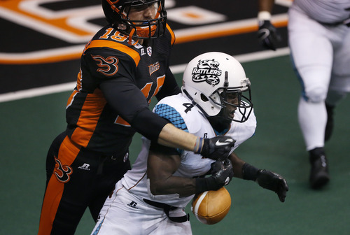 Scott Sommerdorf   |  The Salt Lake Tribune
Blaze defender Chase Deader forces Rattler returner Virgil Gray to  fumble on a kickoff, but the Rattlers later recovered. The Blaze were down 33-28 at the half in their Arena League home opener against the Arizona Rattlers, Friday, March 29, 2013.
