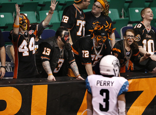 Scott Sommerdorf   |  The Salt Lake Tribune
Blaze fans in "The Fire Pit" heckle Rattlers WR Jared Perry prior to a fisrt half kickoff. The Blaze were down 33-28 at the half in their Arena League home opener against the Arizona Rattlers, Friday, March 29, 2013.