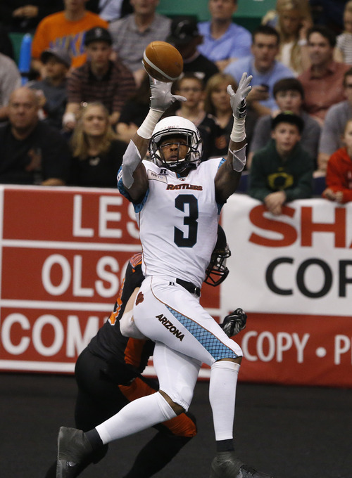 Scott Sommerdorf   |  The Salt Lake Tribune
Rattlers WR Jared Perry catches a first half TD. The Blaze were down 33-28 at the half in their Arena League home opener against the Arizona Rattlers, Friday, March 29, 2013.