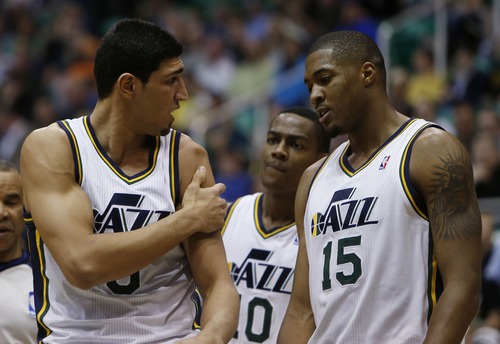 Steve Griffin | The Salt Lake Tribune


Utah's Elec Burks and Derrick Favors, right, look at Enes Kanter as he holds his dislocated shoulder following scramble for a loose ball  during first half action in the Jazz versus Suns NBA game at EnergySolutions Arena in Salt Lake City, Utah Wednesday March 27, 2013. Kanter dislocated his shoulder on the play and left the game.