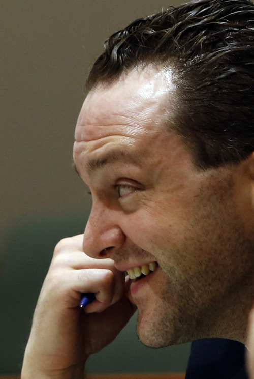 Rick Egan  | The Salt Lake Tribune 

Nathan Sloop laughs at a joke during his preliminary hearing at  2nd District Court in Farmington, Thursday, March 28, 2013. Sloop is charged with the May 2010 death of his stepson, 4-year-old Ethan Stacy.