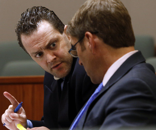 Rick Egan  | The Salt Lake Tribune 

Nathan Sloop talks to his attorney Scott Williams during his preliminary hearing at 2nd District Court in Farmington, Thursday, March 28, 2013. Sloop is charged with the May 2010 death of his stepson, 4-year-old Ethan Stacy.