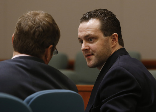 Rick Egan  | The Salt Lake Tribune 

Nathan Sloop talks to his attorney during his preliminary hearing at 2nd District Court in Farmington, Thursday, March 28, 2013.  Sloop is charged with the May 2010 death of his stepson, 4-year-old Ethan Stacy.