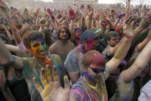 Francisco Kjolseth  |  The Salt Lake Tribune
Revelers dance to the music as they throw bright colorful chalk made of edible maize during Holi, the Festival of Colors at Sri Radha Krishna Temple in Spanish Fork, Utah, Saturday, March 24, 2012. The 2013 version of the event happens Saturday, March 30.