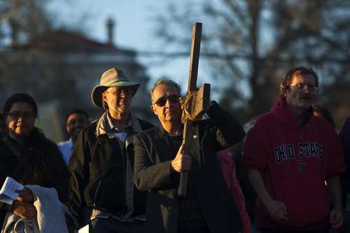 Chris Detrick  |  The Salt Lake Tribune
Patrick Rueda, of Salt Lake City, carries a wooden cross during the Good Friday Procession of the Cross Friday March 29, 2013. Since 1983, the Salt Lake Council of Churches has sponsored this annual procession, which is similar to the tradition of the "Via Dolorosa" (Way of Suffering), where pilgrims to Jerusalem follow the path Jesus took to the cross.
