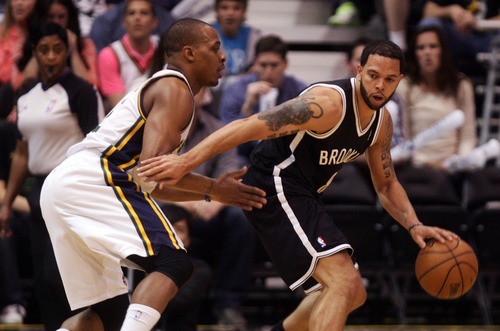 Kim Raff  |  The Salt Lake Tribune
(left) Utah Jazz point guard Randy Foye (8) guards Brooklyn Nets point guard Deron Williams (8) as he looks to pass during a game at EnergySolutions Arena in Salt Lake City on March 30, 2013.