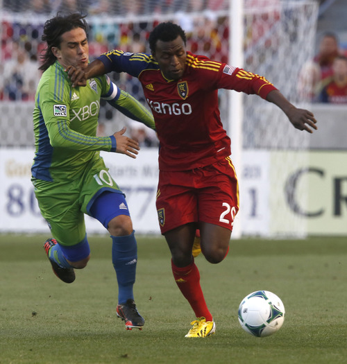 Rick Egan  | The Salt Lake Tribune 

Real Salt Lake midfielder/forward Kenny Mansally (29) goes after the ball as Seattle Sounders FC midfielder Mauro Rosales (10) trails behind, as Real Salt Lake took on the Seattle Sounders, Saturday, March 30, 2013.
