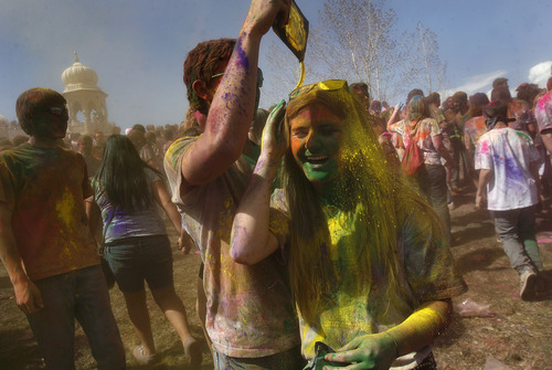 Scott Sommerdorf   |  The Salt Lake Tribune
People cover each other in colors at the 2013 Festival of Colors - Holi Celebration - takes place at the Krishna Temple in Spanish Fork, Saturday, March 30, 2013. The festival celebrates Holi, the announcement of the arrival of spring.