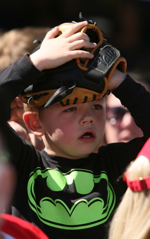 Leah Hogsten  |  The Salt Lake Tribune
Ethan Goff, 6, is very upset that the Colorado Rockies players have not thrown him a baseball in between innings. Seattle defeated Colorado 4-3, Saturday, March 30, 2013, in the final exhibition tuneup of spring training as 15,411 spectators enjoyed the first Major League Baseball game played in Salt Lake City since 1970 at  Spring Mobile Ballpark.
