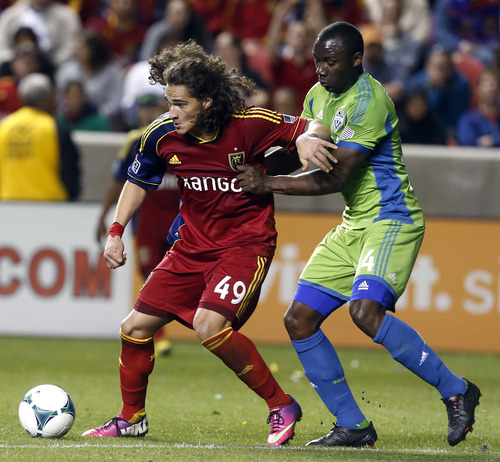 Rick Egan  | The Salt Lake Tribune 

Real Salt Lake forward Devon Sandoval (49) tries to get to the ball, as Seattle Sounders FC defender Patrick Ianni (4) defense,  in MSL action,  as Real Salt Lake took on the Seattle Sounders, at Rio Tinto Stadium,  Saturday, March 30, 2013.