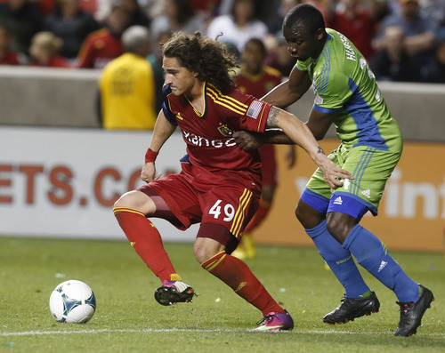 Rick Egan  | The Salt Lake Tribune 

Real Salt Lake forward Devon Sandoval (49) tries to get to the ball, as Seattle Sounders FC defender Patrick Ianni (4) defense,  in MSL action,  as Real Salt Lake took on the Seattle Sounders, at Rio Tinto Stadium,  Saturday, March 30, 2013.