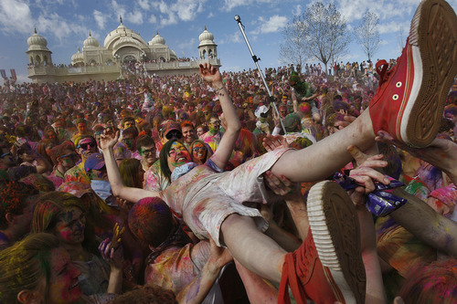 Scott Sommerdorf   |  The Salt Lake Tribune
"Crowd surfing" at the 2013 Festival of Colors - Holi Celebration - takes place at the Krishna Temple in Spanish Fork, Saturday, March 30, 2013. The festival celebrates Holi, the announcement of the arrival of spring.