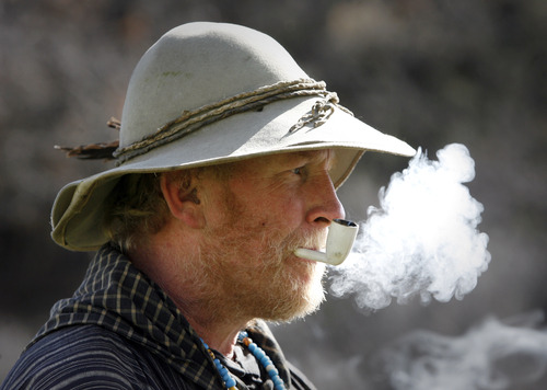 Rick Egan  | The Salt Lake Tribune 

Ken Stanley, Pocatello, ID puffs on a clay pipe, at the Fort Buenaventura Easter Rendezvous in Ogden, Saturday, March 30, 2013.