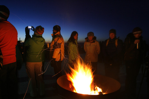 Scott Sommerdorf   |  The Salt Lake Tribune
Fire pits kept early arrivals warm before the Easter sunrise service. Snowbird hosted the service at 11,000 feet of elevation on Hidden Peak, Sunday, March 31, 2013.