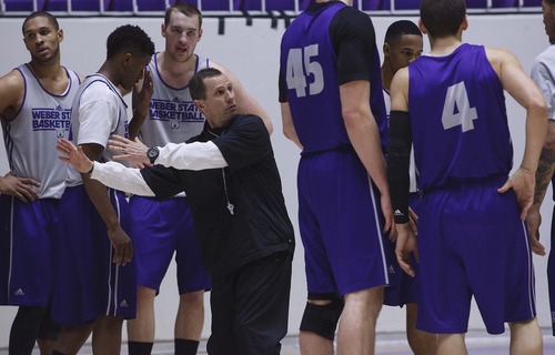 Leah Hogsten  |  The Salt Lake Tribune
Weber State basketball coach Randy Rahe, center, says only good can come from Weber State's run to the title game of the collegeinsider.come title game Tuesday in Ogen.