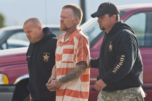 Chris Detrick  |  The Salt Lake Tribune
Troy Knapp is escorted into the Sanpete County Sheriff's Office Tuesday April 2, 2013. The 45-year-old wilderness survivalist had frustrated law enforcement for more than five years as he continued to elude capture before surprising the group of antler hunters, who reported the sighting to police.