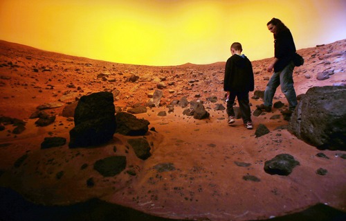 Steve Griffin | The Salt Lake Tribune


Tori Andersen and her son, Andrew, enjoy a stroll on Mars at the Clark Planetarium at The Gateway in Salt Lake City, Utah Tuesday March 26, 2013.