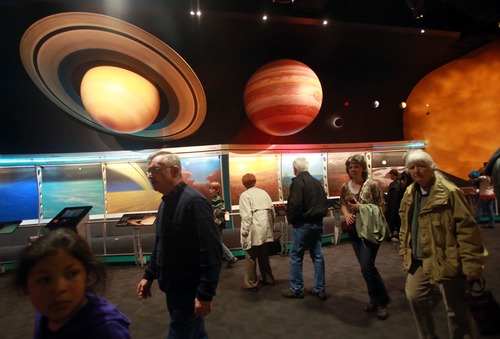 Kim Raff  |  The Salt Lake Tribune
Visitors view The Solar System exhibit at the Clark Planetarium in Salt Lake City on March 25, 2013. The planetarium is celebrating its 10th anniversary.