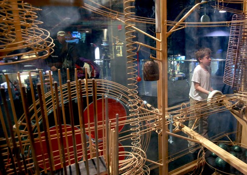 Kim Raff  |  The Salt Lake Tribune
Caleb Baird interacts with Newton's Daydream, an audio-kinetic sculpture, at the Clark Planetarium in Salt Lake City on March 25, 2013. The planetarium is celebrating its 10th anniversary.