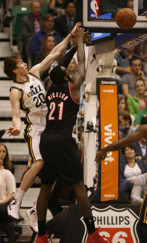 Rick Egan  | The Salt Lake Tribune 

Utah Jazz shooting guard Gordon Hayward (20) knocks the ball out of the hands of Portland Trail Blazers center J.J. Hickson (21),  in NBA action, as the Jazz faced the Portland Trailblazers, at EnergySolutions Arena, Monday, April 1, 2013.