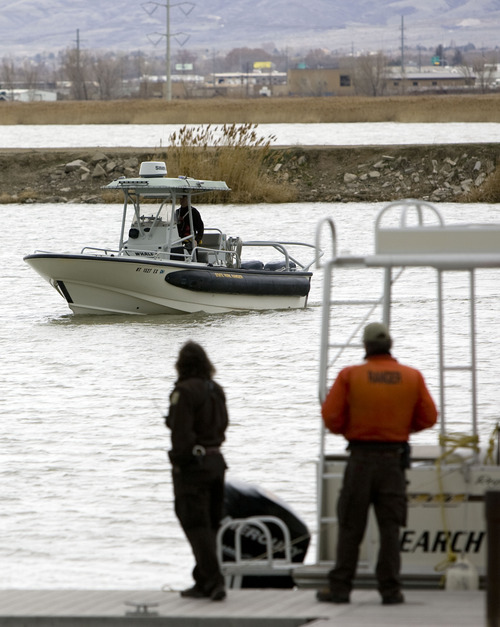 Kim Raff  |  The Salt Lake Tribune
Search and rescuers from the Utah County Sheriff's Office return to the staging area at the Lindon Boat Harbor during a search for missing boater Tam Huynh on Utah Lake in Lindon on April 1, 2013.