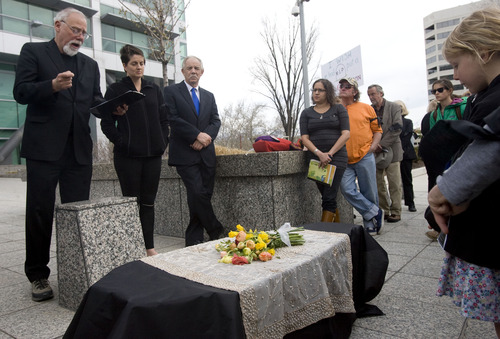 Kim Raff  |  The Salt Lake Tribune
Protesters of the Keystone XL Pipeline gather around a coffin as the Rev. Tom Goldsmith of First Unitarian Church delivers opening remarks during a "Funeral for the Future" protest outside the Wallace F. Bennett Federal Building in Salt Lake City on April 4, 2013. Dozens of protesters gather to call attention to Utah's congressional delegation's support for the Keystone XL Pipeline.