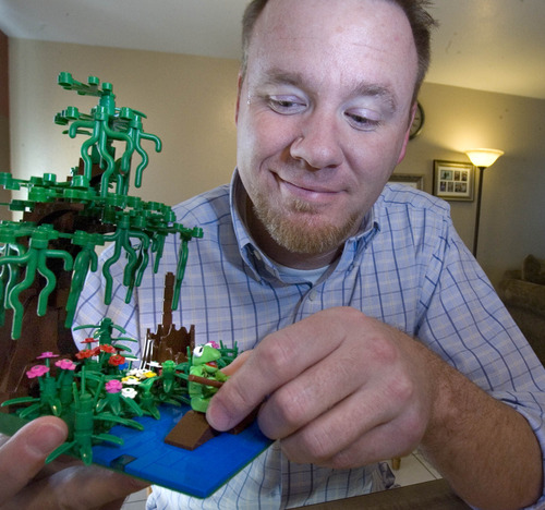Paul Fraughton  |  The Salt Lake Tribune
Quinn Rollins places his home-made Lego Kermit The Frog on his Lego frog pond.