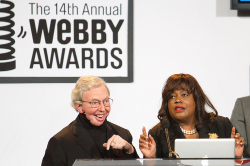 FILE - This June 14, 2010 file photo shows film critic Roger Ebert, left, alongside wife Chaz Hammelsmith, accepting the "Person of the Year" Award at the 14th Annual Webby Awards in New York. The Chicago Sun-Times is reporting that its film critic Roger Ebert died on Thursday, April 4, 2013. He was 70.  (AP Photo/Charles Sykes, file)