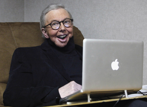 FILE - In this Jan. 12, 2011 file photo, Pulitzer Prize-winning movie critic Roger Ebert works in his office at the WTTW-TV studios in Chicago. The Chicago Sun-Times is reporting that its film critic Roger Ebert died on Thursday, April 4, 2013. He was 70.  (AP Photo/Charles Rex Arbogast, File)