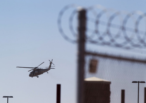 A helicopter believed to be carrying Homeland Security Secretary Janet Napolitano takes off from the Brian A. Terry Border Patrol Station outside in Bisbee, Ariz. on Friday, Oct. 5, 2012. A preliminary investigation has found friendly fire likely was to blame in the shootings of two border agents along the Arizona-Mexico border, the FBI said Friday. (AP Photo/The Arizona Republic, David Wallace)  MARICOPA COUNTY OUT; MAGS OUT; NO SALES